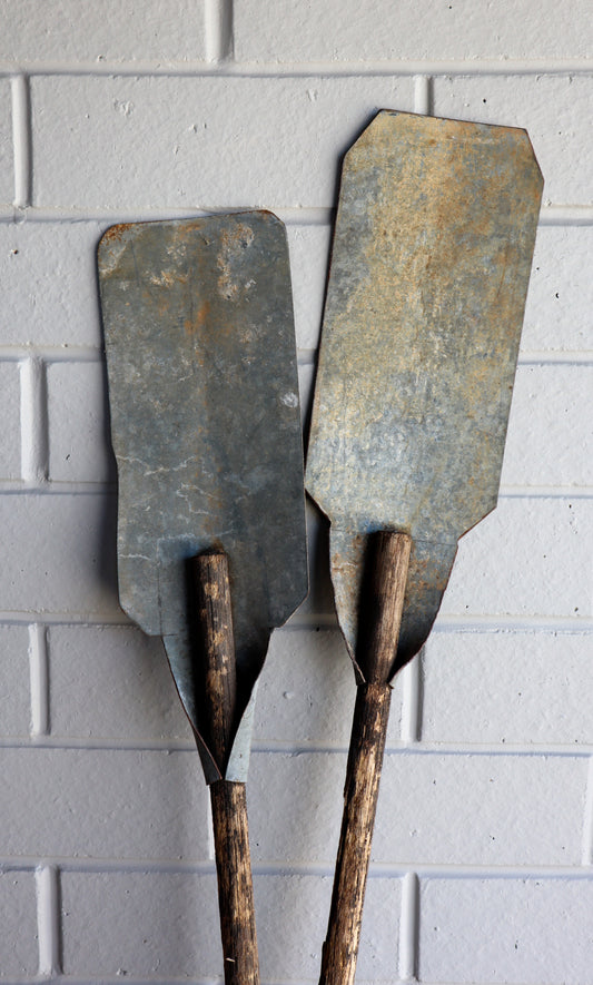 Vintage galvanised metal and wooden paddles